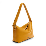 Sunshine Small | Slouchy Shoulder Bag that has a zipper opening and three metal tree emblems on a white background