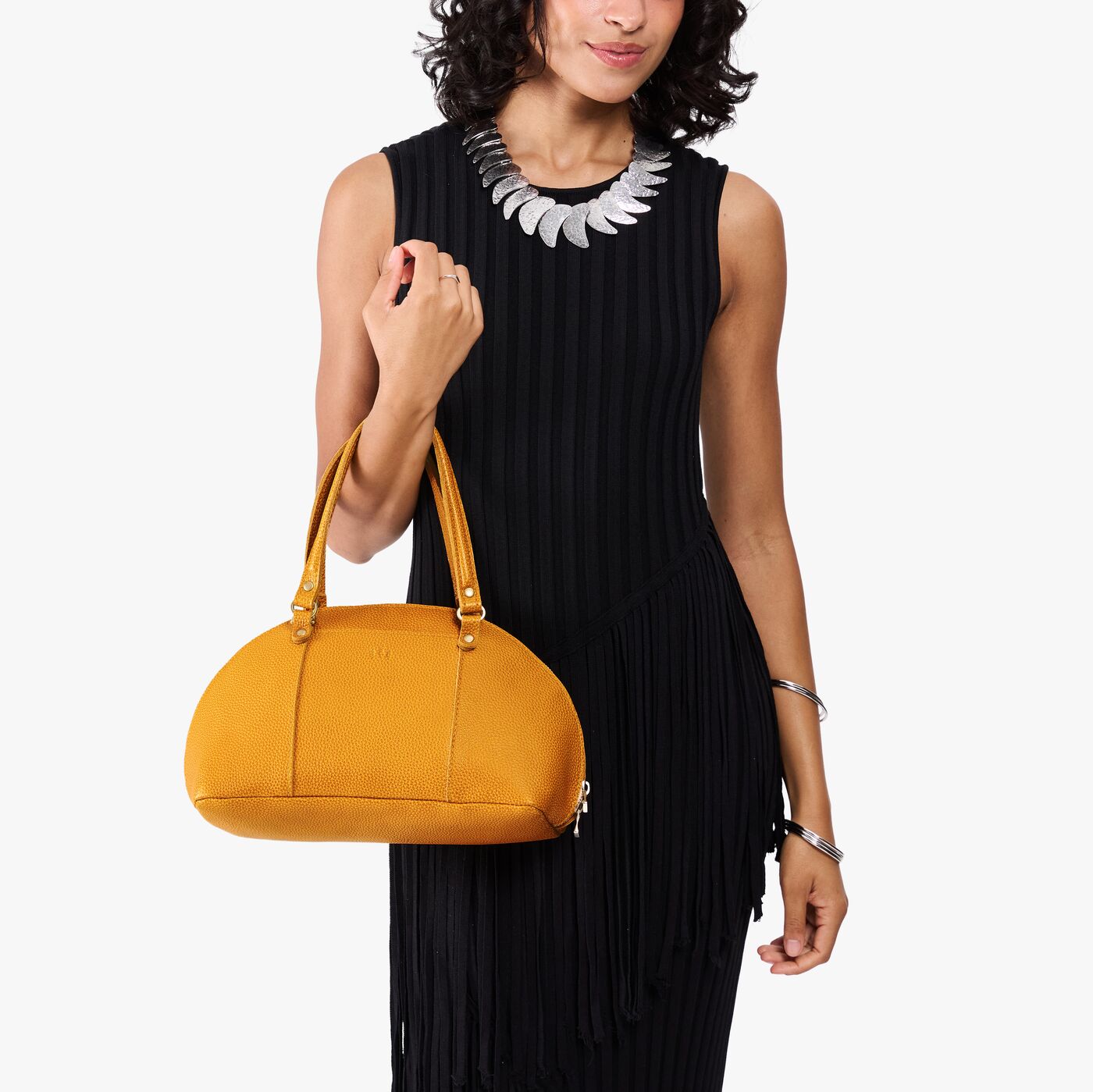 Sunshine*Small | Model holding a half circle crossbody bag with handles and removable crossbody strap 