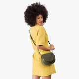 Old Growth Small | Model wearing a leather Crossbody with a flap and magnetic closure