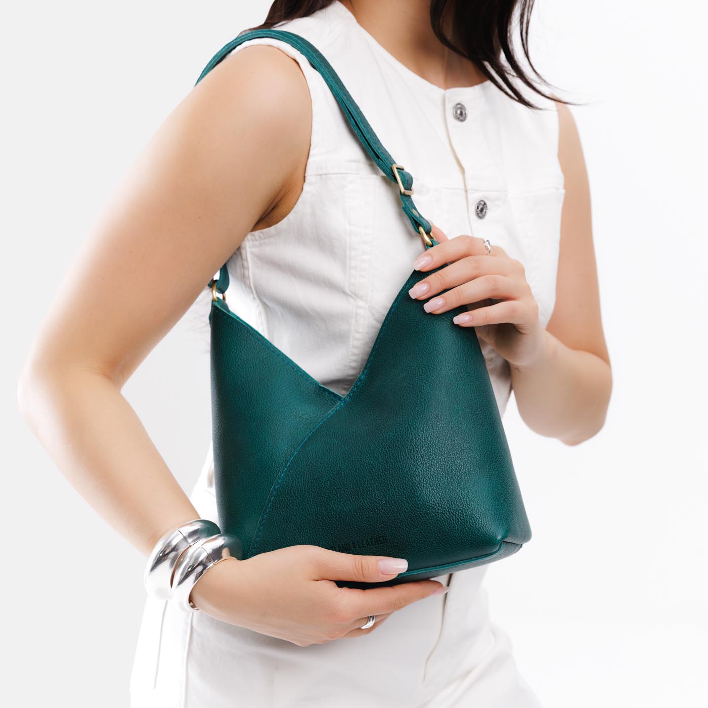 Sea Glass*Small | Model wearing petite shoulder bag with adjustable strap and magnetic snap closure