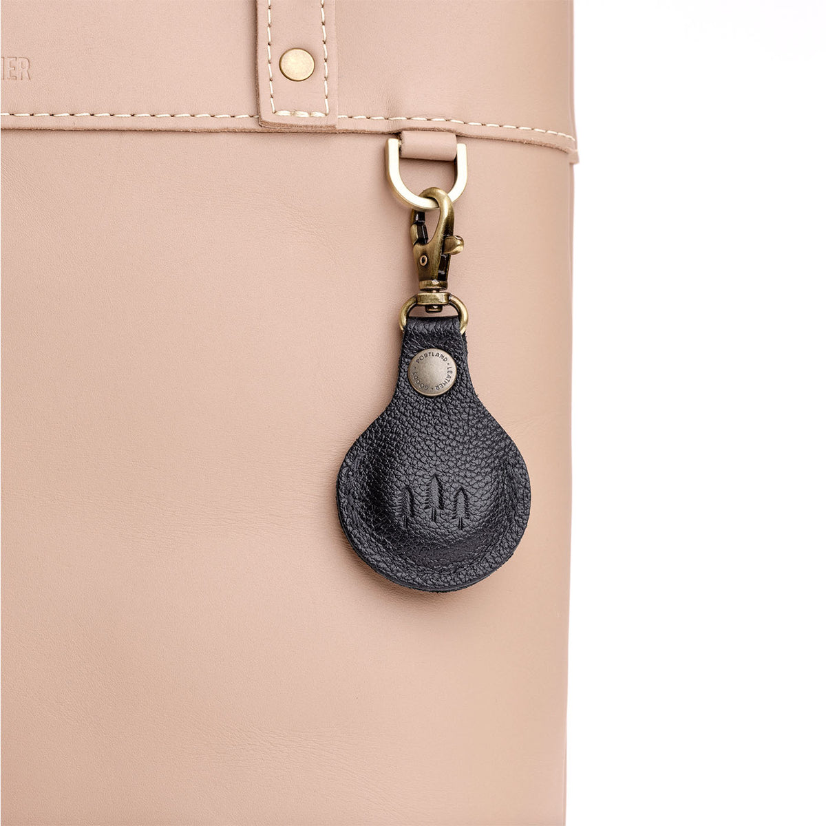 Pebbled--black | Round leather AirTag holder with snap closure and swivel lobster claw clasp