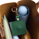 Bacalar | Square-shaped leather AirTag holder with snap closure and swivel lobster claw clasp