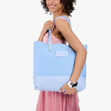Icy | Model carrying canvas tote with leather base and handles