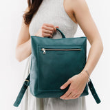 ANY | Person holding Classic Tote Backpack