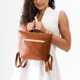 ANY | Person holding Small Tote Backpack