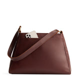 Cognac Large | Large triangular shoulder bag with antiqued brass finished hardware