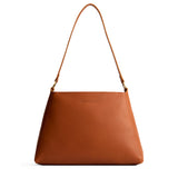 Honey Large | Large triangular shoulder bag with antiqued brass finished hardware