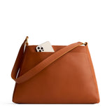 Honey Large | Large triangular shoulder bag with antiqued brass finished hardware