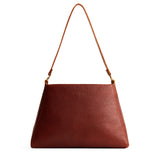 Nutmeg Large | Large triangular shoulder bag with antiqued brass finished hardware
