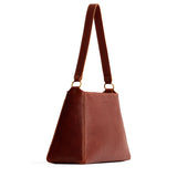 Nutmeg Large | Large triangular shoulder bag with antiqued brass finished hardware