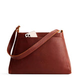 Nutmeg Large | Large triangular shoulder bag with antiqued brass finished hardware
