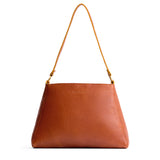 Sienna Large | Large triangular shoulder bag with antiqued brass finished hardware