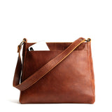Nutmeg Small | Triangular shoulder bag with antiqued brass finished hardware
