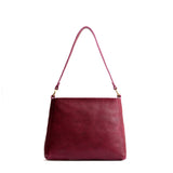 Orchid Small | Triangular shoulder bag with antiqued brass finished hardware