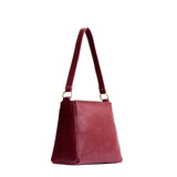 Orchid Small | Triangular shoulder bag with antiqued brass finished hardware
