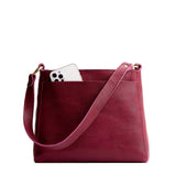 Orchid Small | Triangular shoulder bag with antiqued brass finished hardware