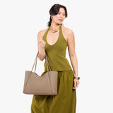 Stone Large | Model holding a large rectangular tote bag