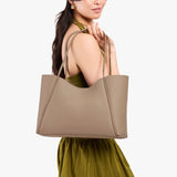 Stone Large | Model holding a large rectangular tote bag