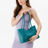 Aquarius Medium | Model holding midsize rectangular tote bag