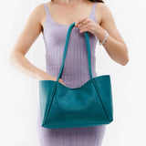 Aquarius Medium | Model holding midsize rectangular tote bag