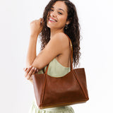 Nutmeg Medium | Model holding midsize rectangular tote bag