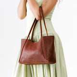 Nutmeg Medium | Model holding midsize rectangular tote bag