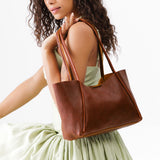 Nutmeg Medium | Model holding midsize rectangular tote bag