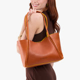 Sienna Medium | Model holding midsize rectangular tote bag