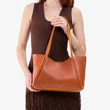 Sienna Medium | Model holding midsize rectangular tote bag