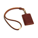Nutmeg | A leather lanyard attached to a matching card holder on a white background