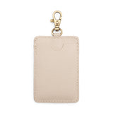 Pebbled Bone | A leather card holder with a swivel lobster clasp on a white background