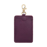 Plum | A leather card holder with a swivel lobster clasp on a white background