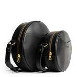 Black | Size comparison image of small and large circle shaped crossbody bags with top zipper