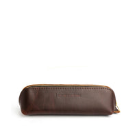 All Color: Grizzly | Leather pouch with curved seams and top zipper